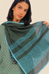 Embroidered shawl in cotton gauze.